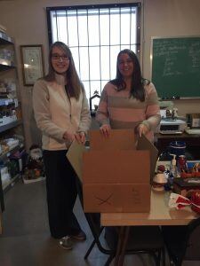 Beth and Kim, donating a box of food items to the Food Pantry in Herrin, Illinois